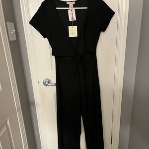 Romper-short sleeve, flared pants with belly cut outs.